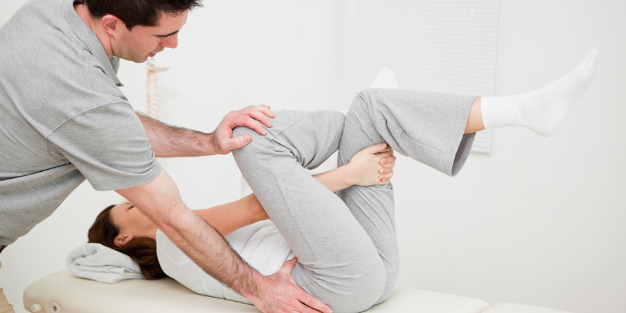 Physiotherapist giving trreatment to woman